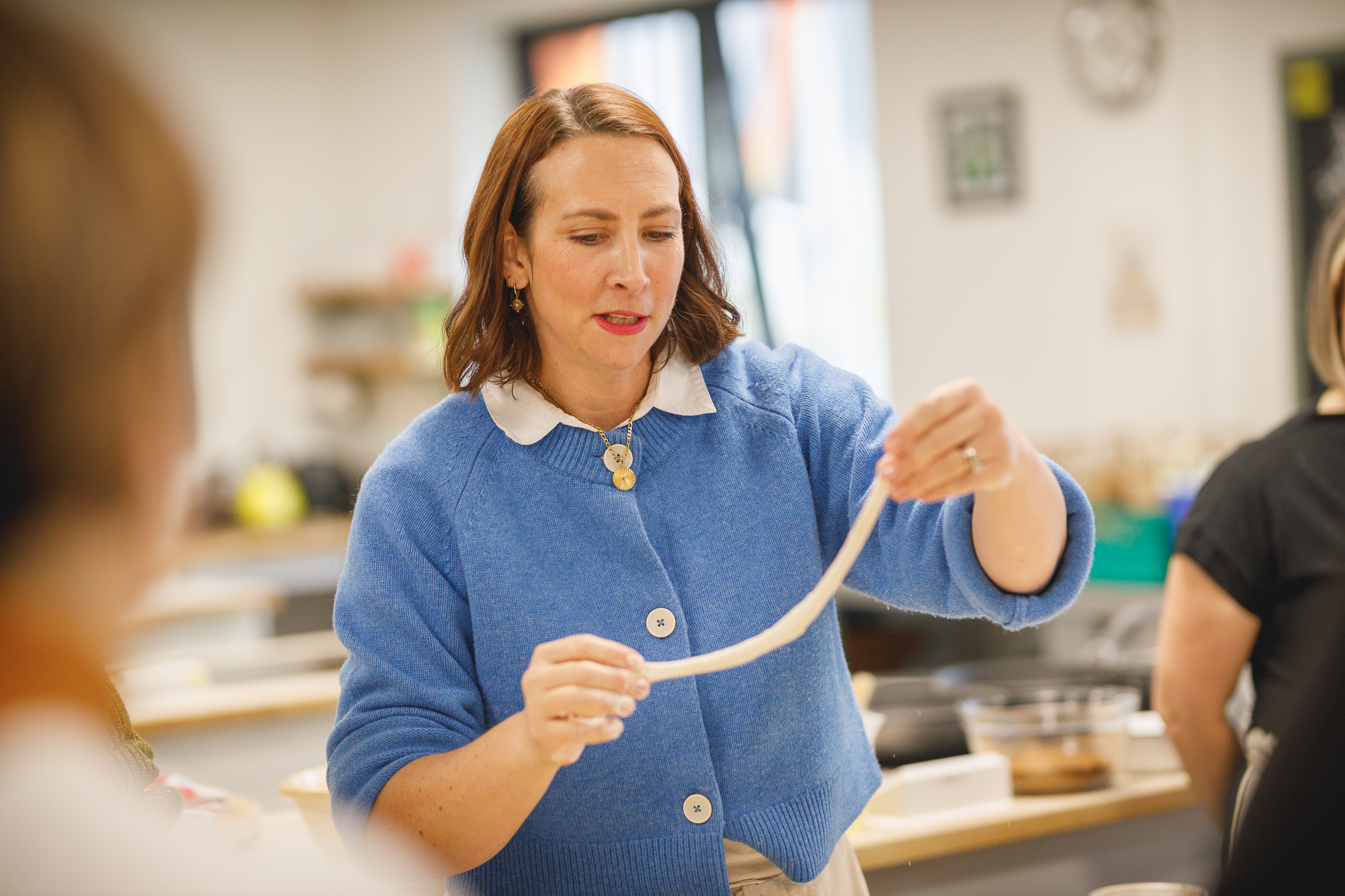 Teacher Charlotte making pasta.jpg