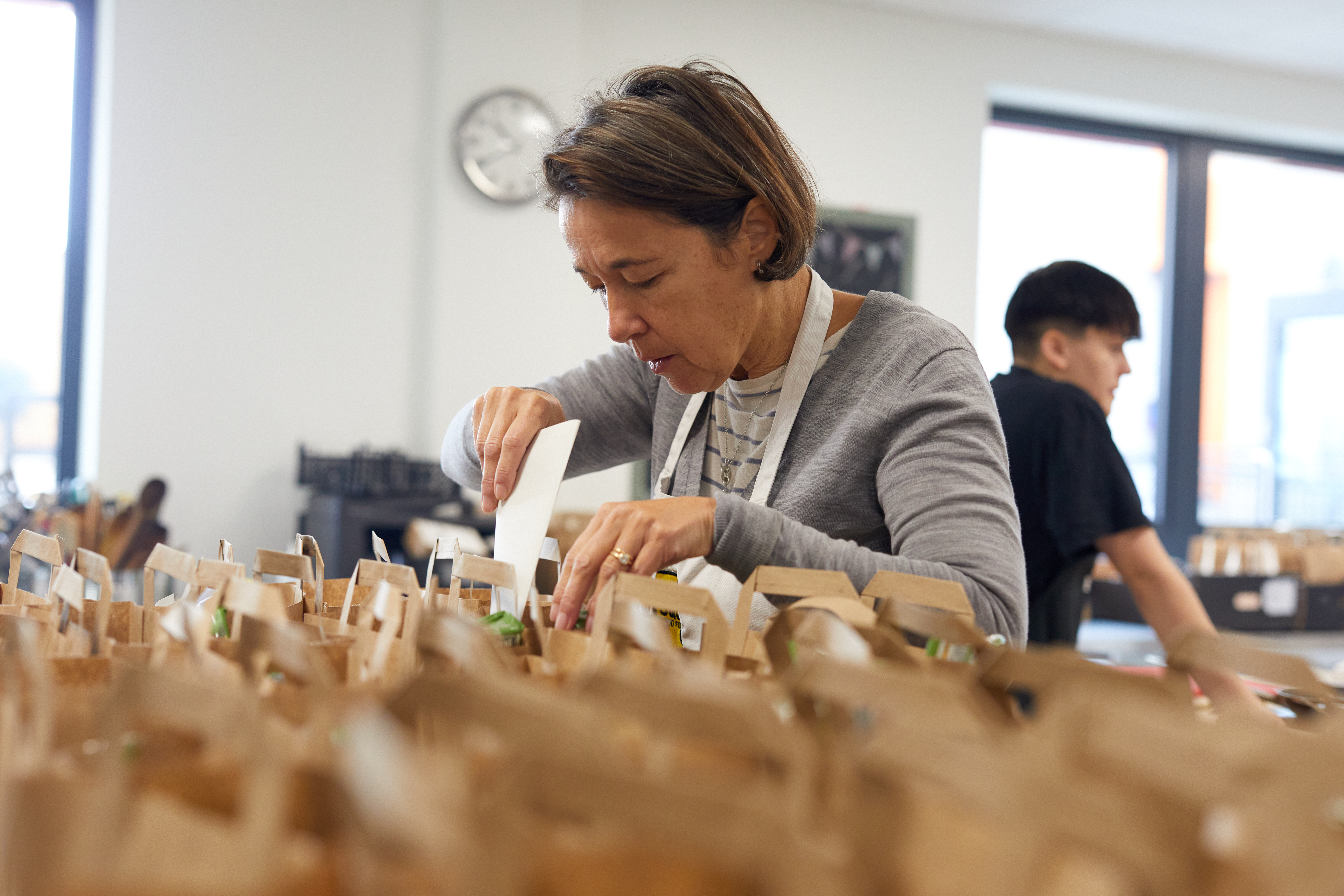 Volunteer packing recipe into kits.jpg