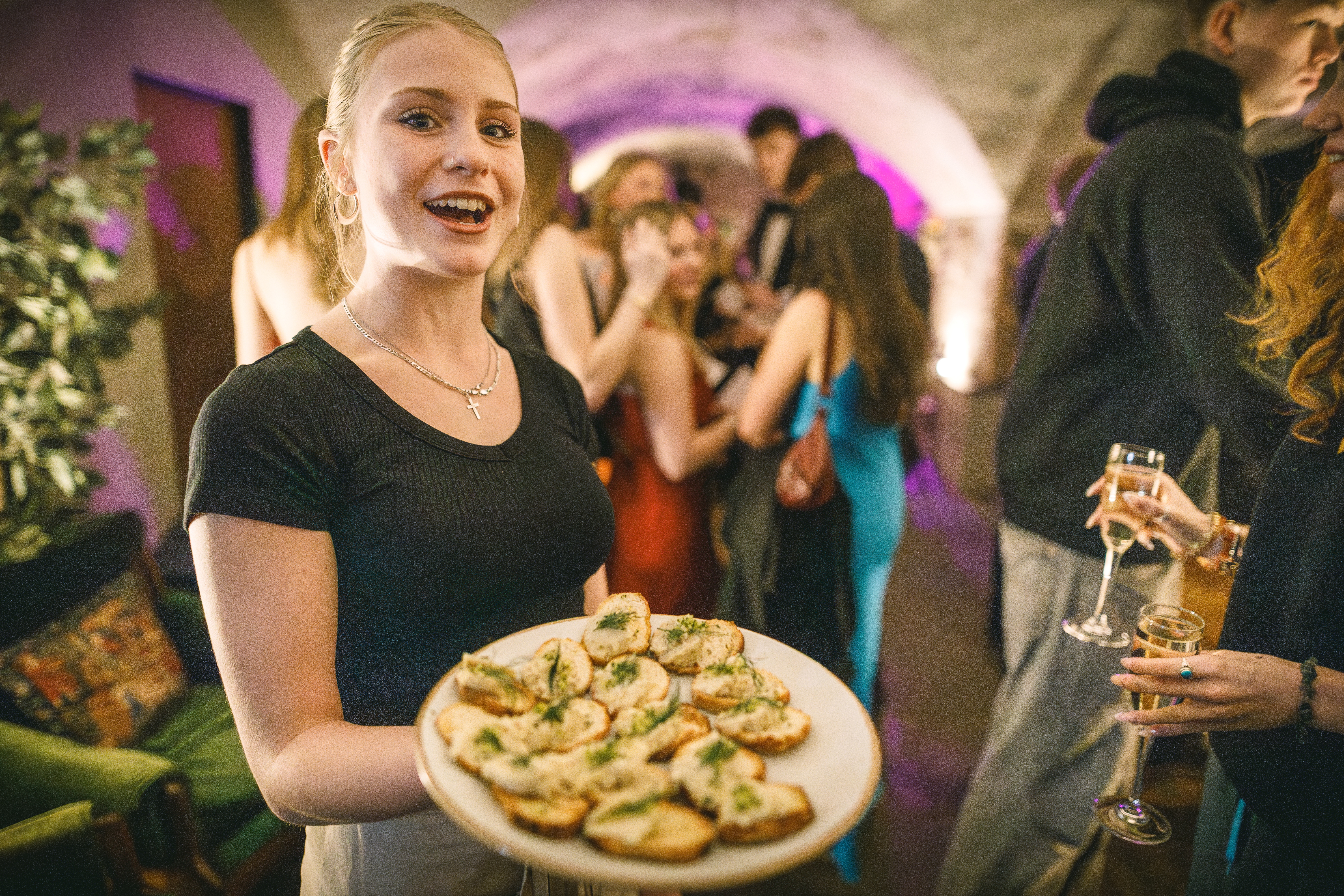 Person serving food at event.jpg
