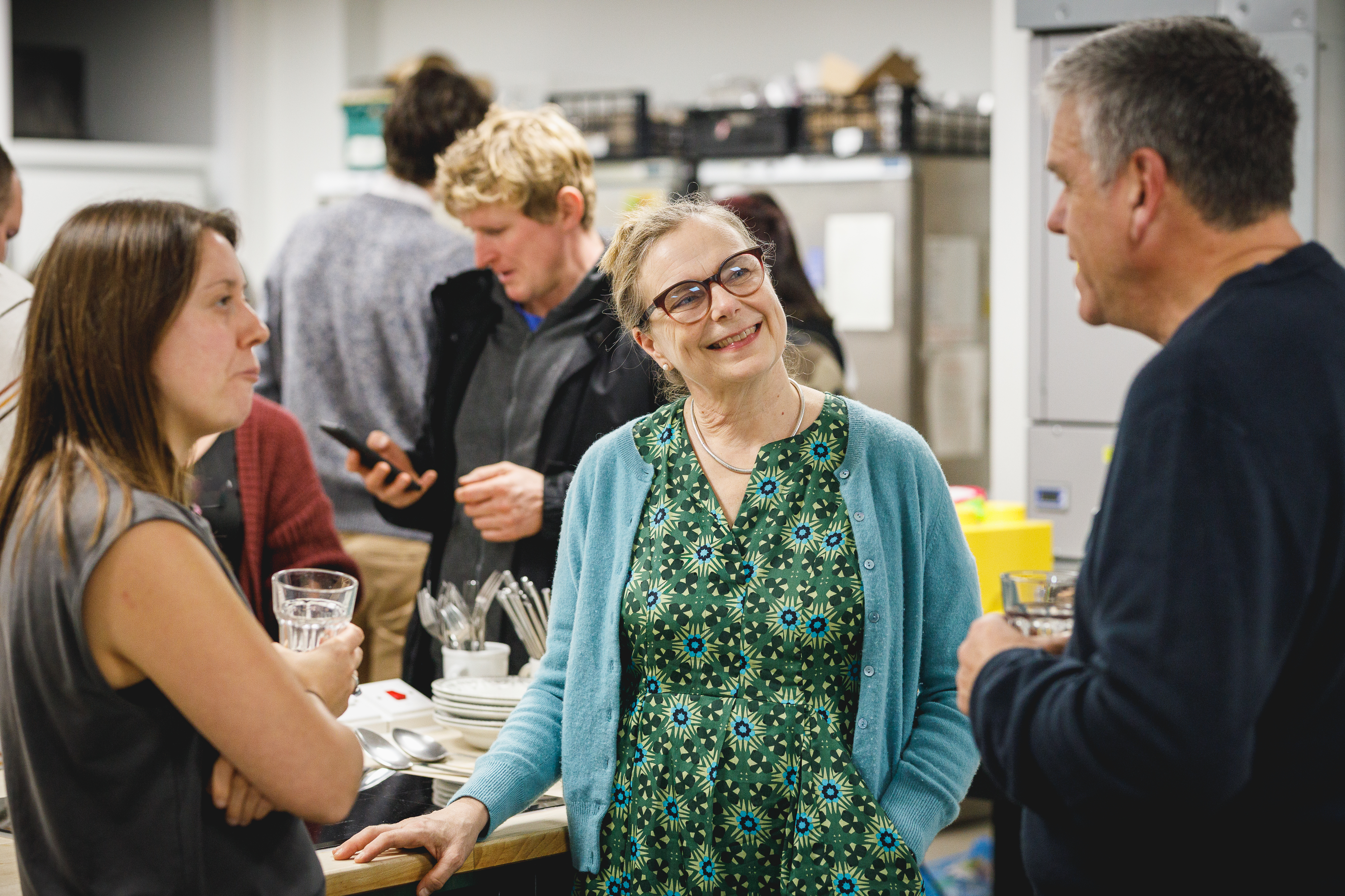 Several people talking together at a party.jpg