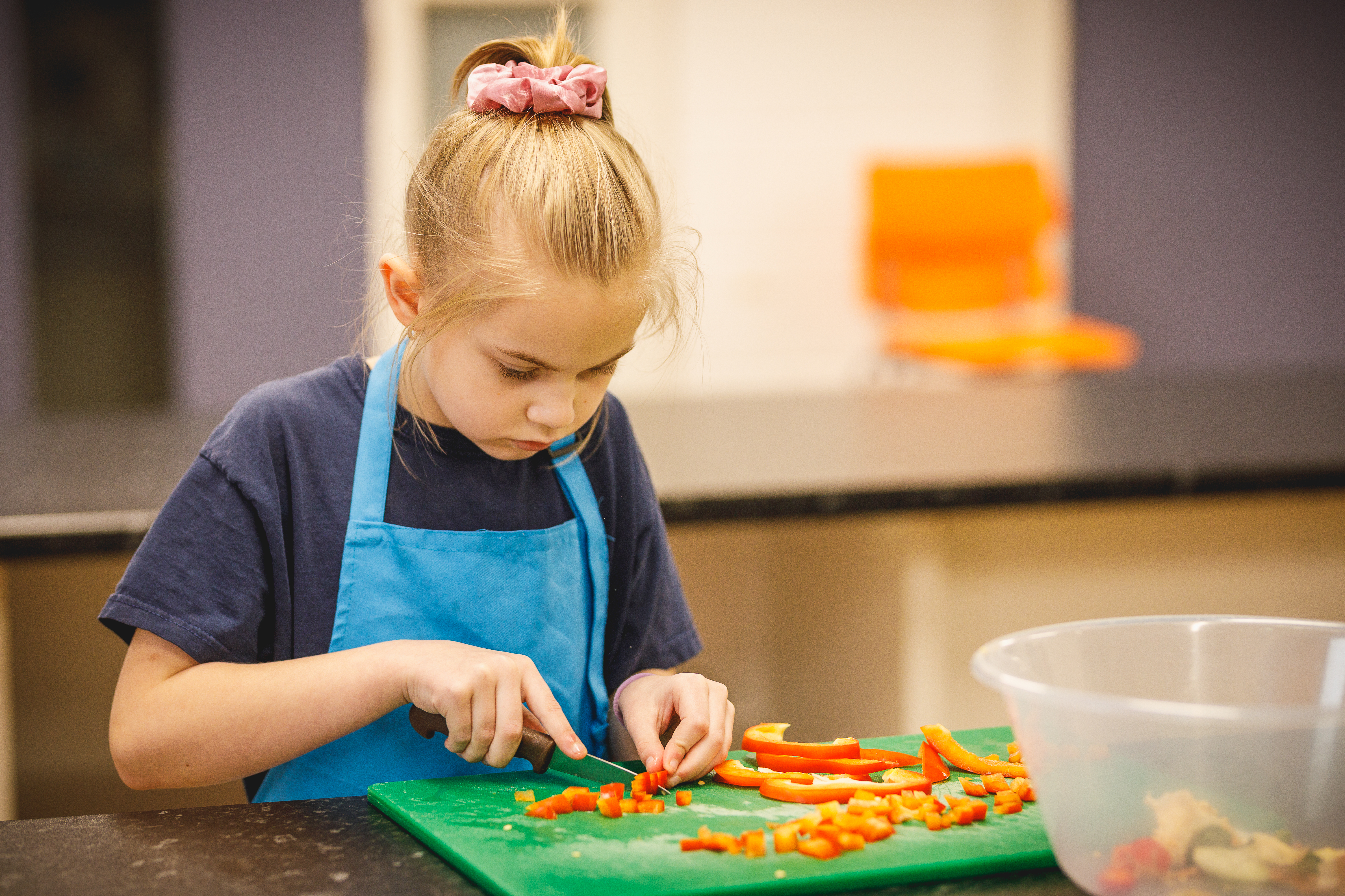 Young child chopping peppers.jpg