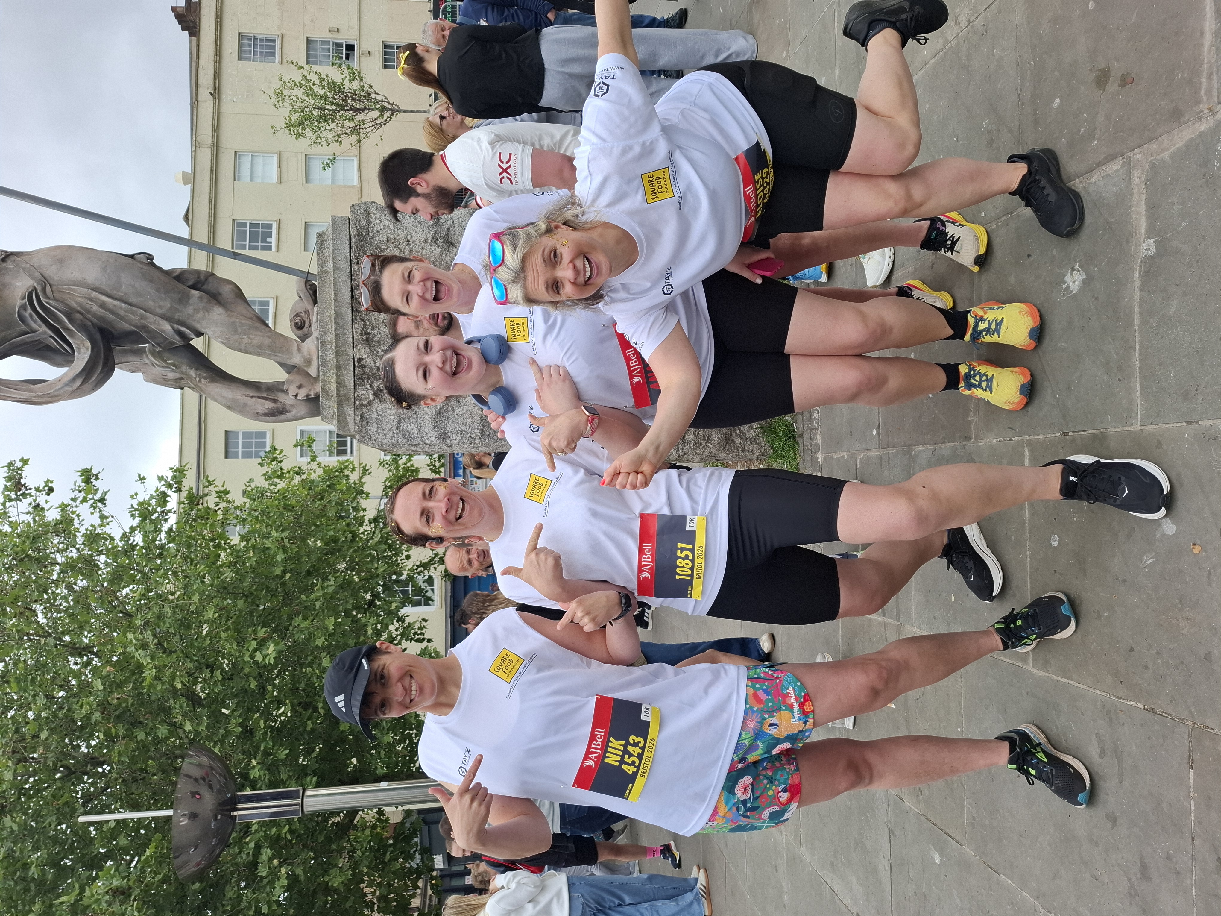 Five people running for charity in Square Food Foundation t-shirts.jpg