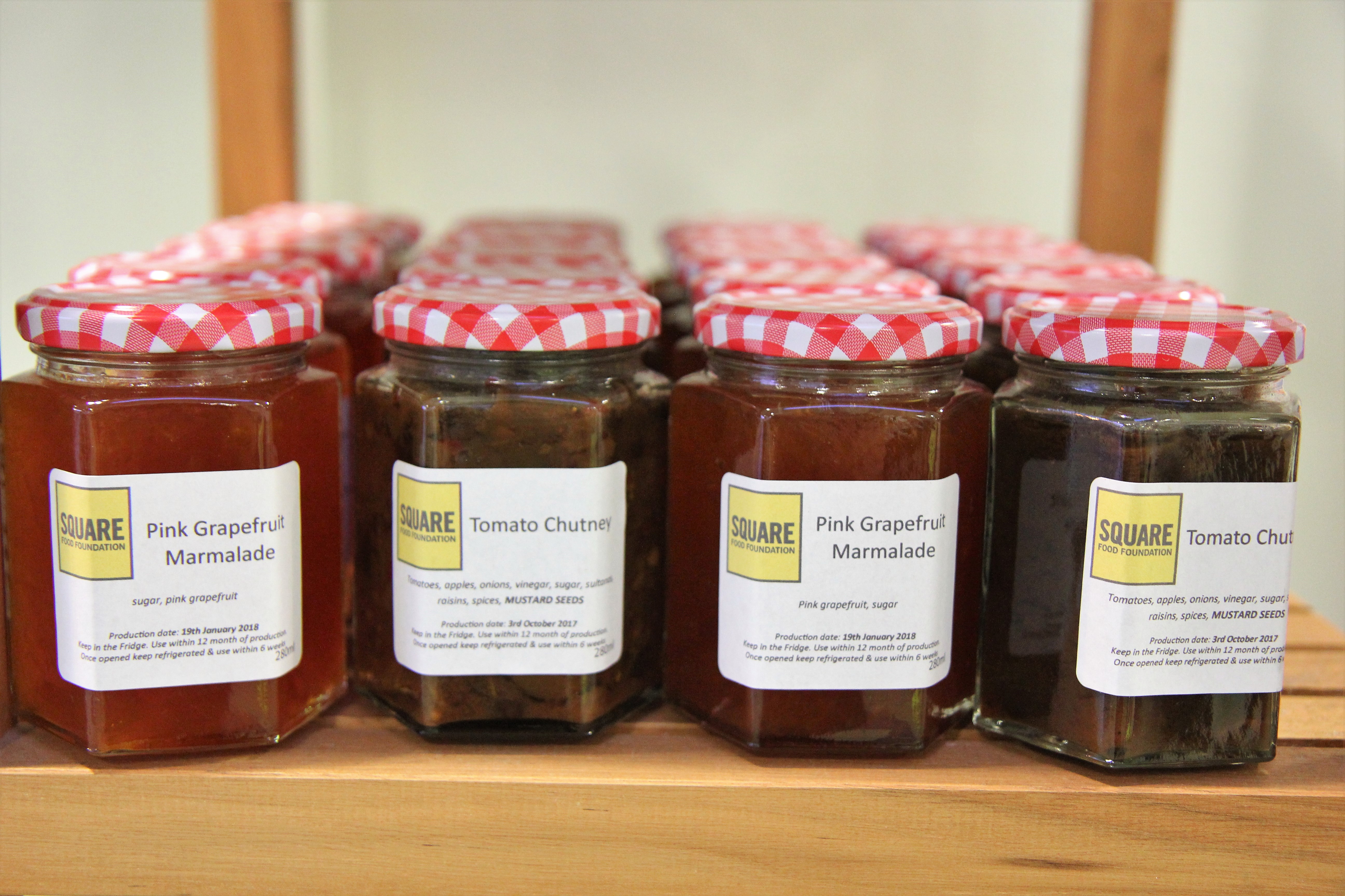Homemade jam and chutney on a shelf.JPG