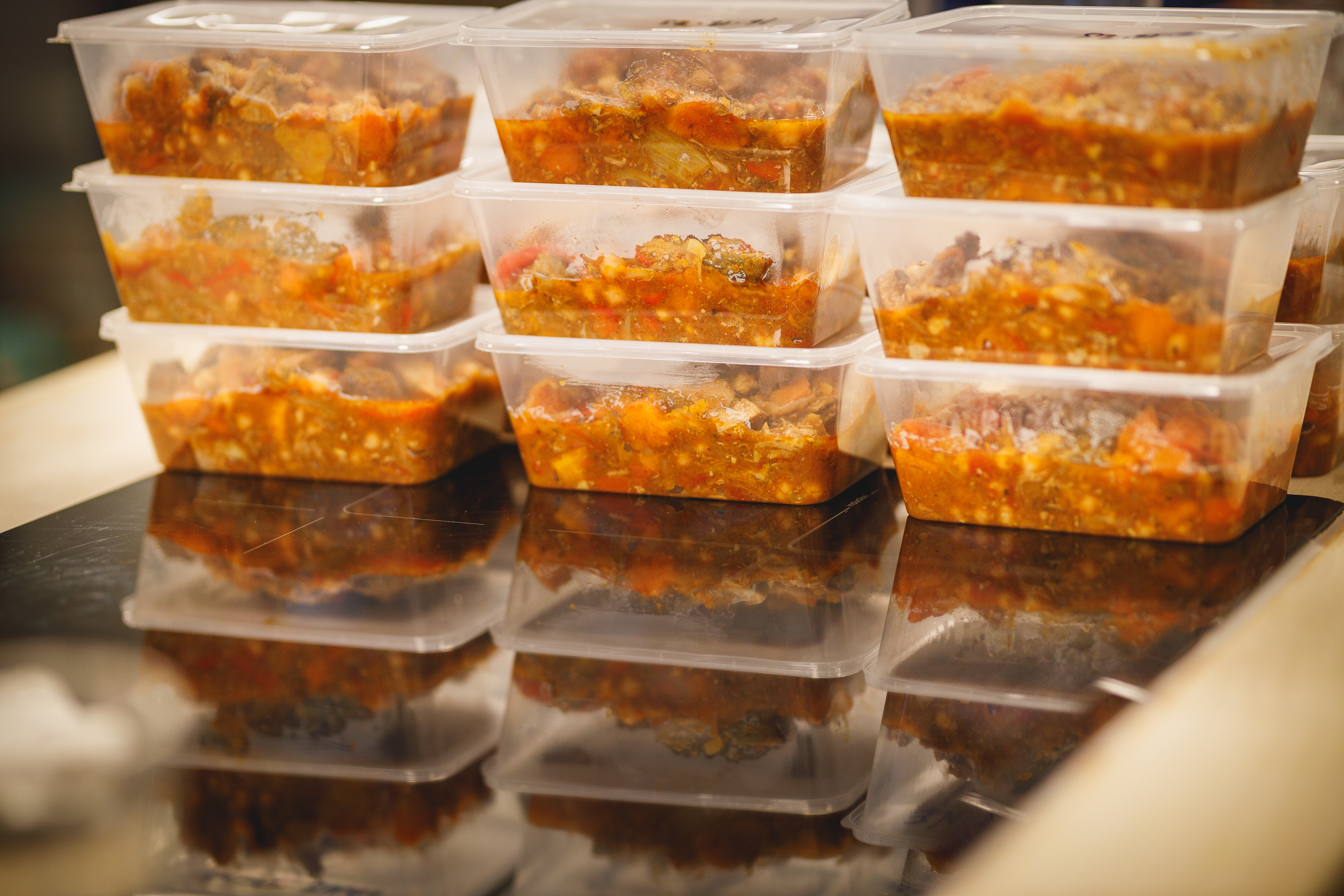 A row of packaged batch-cooked meals in the kitchen