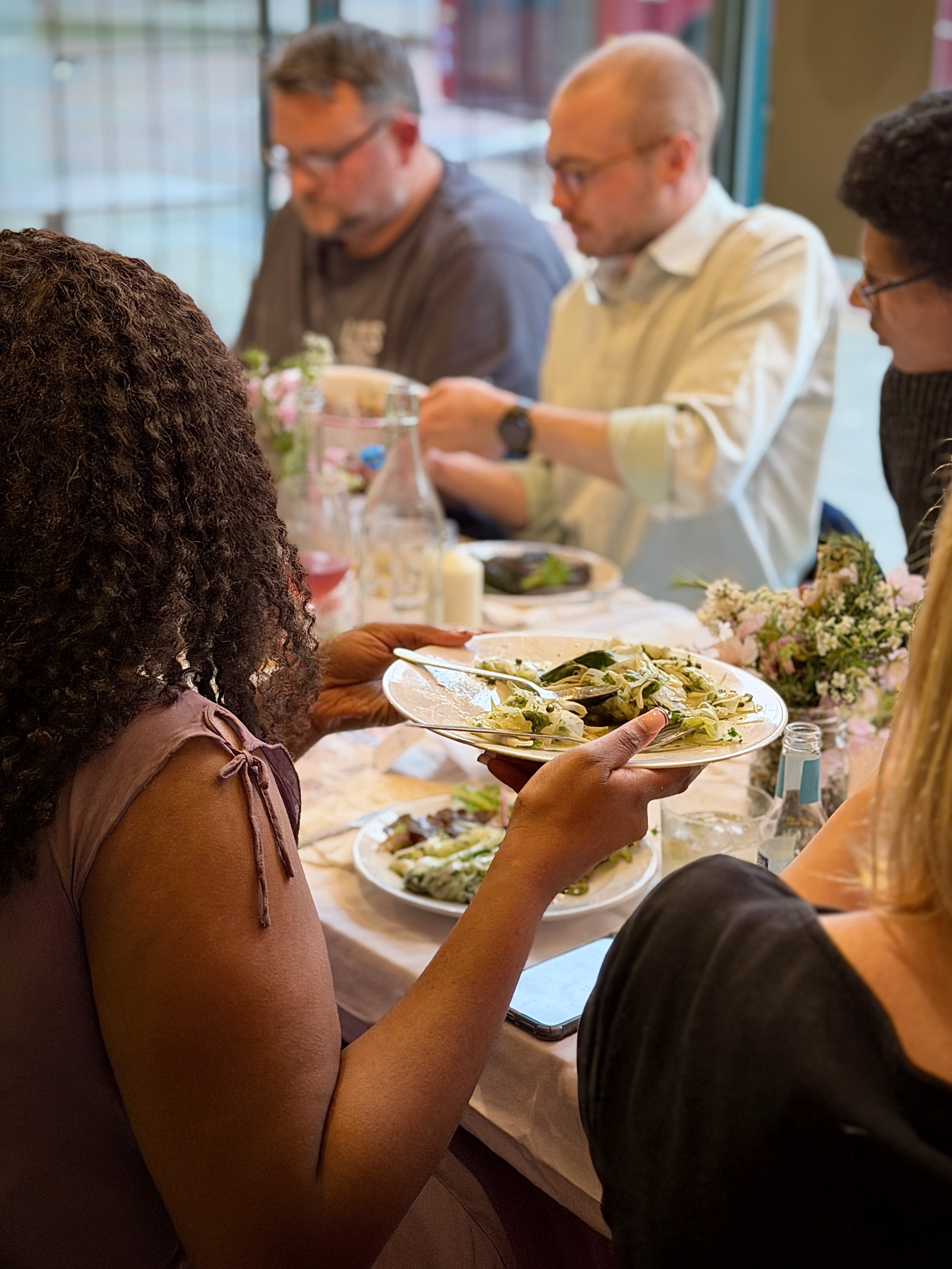 food being passed at a dinner party